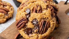 cookies with chocolate chips and pecans on a cutting board