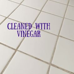 a tile floor with the words cleaned with vinegar on it