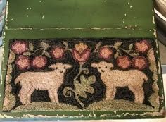 a door mat with sheep and flowers on it