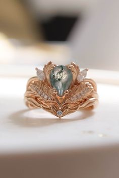 a heart shaped ring sitting on top of a table