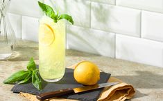 a lemon and basil drink on a cutting board