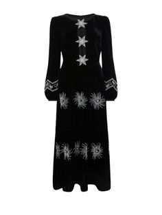 The Camille dress in black with embellished pearl stars is a midi length dress in a luxury liquid velvet that features an alluring split neckline held together by three decorative stars. Each is densely hand-embroidered with crystals, beads, and faux pearls to create a unique trompe l’oeil effect. It features a fitted bust and gathered waist into a flowing midi-length skirt, with romantic blouson sleeves elegantly fastened with a contrast-covered button cuff. Fully lined and invisible zip closure at center back. Model is 180 cm/ 5'9'' tall and wears a UK size 8. Composition & Care: 82% Rayon, 18% Silk. Delicate Dry Clean Only. Stars Dress, Camille Dress, Crystals Beads, Cap Fashion, Midi Length Skirts, Star Dress, Midi Length Dress, Lingerie Sleepwear, Swimwear Tops