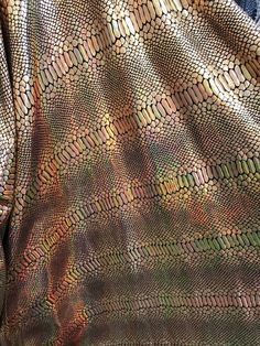 This 2-way stretch fabric is 80% Nylon and 20% Spandex with a 2-way stretch. It features a reflective and shimmering snake skin scale print. This snake print are Ideal for costumes, dresses, leggings, clothing, nightgowns,prom dresses, swim suits,interior decor and much more.. 2-ways stretch Lycra-Spandex. Width:58-60 inches. Length:36 inches- each yard. This item is also available in increments of more than one yard in one piece. Dear costumer the shipping of you item may take 3-5 days do to th Iridescent Snake, Scale Skin, Costumes Dresses, Snake Skin Print, Iridescent Green, Vine Design, Swim Suits, Stretch Velvet, Nightgowns