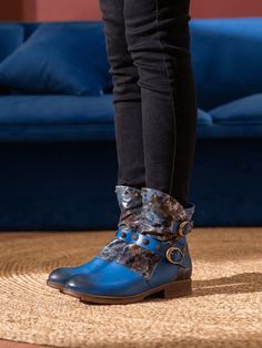 Be the one to watch in the Soffia Nicolette Boots! These stylish moto boots are crafted from supple leather and feature rivet stud accents for a look that won't go unnoticed. Whether you want a daring and daring look or an edgy vibe, these boots are the perfect way to stand out! 1.18" heel 4.8" shaft 11.8'' circumference Zip & buckle closure Leather upper Leather lining Leather midsole Leather insole Rubber sole Edgy Riveted Ankle Moto Boots, Leather Lace-up Moto Boots With Rivets, Leather Ankle Moto Boots With Lace-up Fastening, Blue Leather-lined Boots With Round Toe, Luxury Lace-up Ankle Moto Boots, Reindeer Headband, Leather Moto, Be The One, Moto Boots