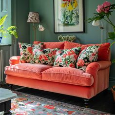 a living room filled with furniture and flowers