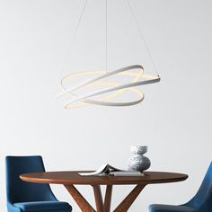 a dining table with two chairs and a light fixture hanging from the ceiling