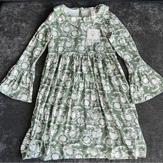 This Is A Silky Soft Dress Made From 95% Viscose From Bamboo And 5% Lycra. It Has Flared Sleeves, A Collared Neck And Buttons On The Back. Spring Casual Flowy Twirl Dress, Flowy Casual Twirl Dress For Spring, Casual Flowy Spring Twirl Dress, Long Sleeve Floral Print Dress For Dress-up, Green Long Sleeve Dress For Dress-up, Casual Dresses With Ruffle Hem, Casual Dress With Ruffle Hem, Casual Dress With Ruffle Hem For Dress-up, Fitted Green Twirl Dress For Spring