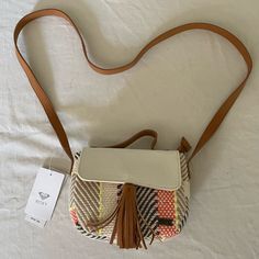 Roxy Crossbody Bag Purse Perfect Summer Purse With Colorful Fabric Design And Camel Brown Faux Leather Details. Long Strap & Purse Handle Brand New With Tag - Never Used! Cream Crossbody Shoulder Bag For Vacation, Casual Cream Crossbody Shoulder Bag, Casual Cream Crossbody Satchel, Cream Crossbody Satchel For Vacation, Cream Satchel With Adjustable Strap For Vacation, Spring Cream Crossbody Shoulder Bag, Cream Crossbody Shoulder Bag For Spring, Cream Crossbody Satchel For Spring, Long Strap Purse