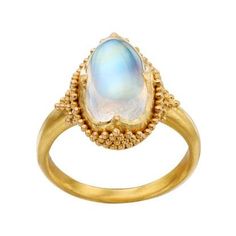 Java is a luminous natural blue moonstone cabachon ring. The exceptional glowing blue white gem is mounted in an exceptional 22k yellow gold mounting embelished with painstaking granulated gold in the Etruscan style. Inspired by the jewelry of antqiuity and hand crafted in Bali. Jewellery Wishlist, Moonstone Cabochon, Pearl And Diamond Ring, Modern And Antique, Blue Moonstone, Cabochon Ring, Moonstone Jewelry, Rose Gold Jewelry, Color Ring