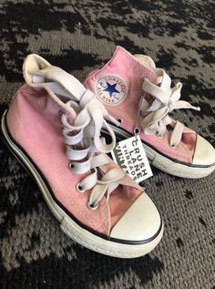 Vintage pink Converse All-Star high-tops. Kids size 10 1/2.    CL loves the idea of re-loving pieces that are unique, full of character, and STILL full of life. We are advocates of slow fashion and reducing our carbon footprint on our environment. Each piece is hand selected and CL approved! Pink High-top Sneakers, Pink High-top Sneakers For Spring Streetwear, Casual Pink Cotton Sneakers, Pink Cotton Sneakers With Round Toe, Pink High-top Sneakers For Spring, Pink Low-top Cotton Sneakers, Spring Pink High-top Sneakers With Round Toe, Pink Cotton Round Toe Sneakers, Pink Cotton Low-top Sneakers