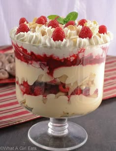 a trifle with raspberries and whipped cream