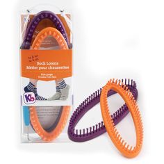 two purple and orange hair combs sitting next to each other