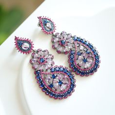 keywords: Jhumka Kundan earrings/statement dangles/wedding jewelry/cultural accessory/anniversary Indian multi-stone handmade/aesthetic Christmas There is another pink-blue color, kindly check the link below  https://www.etsy.com/listing/1779611224/jhumka-kundan-earringsstatement?click_key=ccbc588d6416b13c0f2c3904fb7fbe75a19fe507%3A1779611224&click_sum=074f901b&ref=shop_home_active_54&pro=1&frs=1 👄Item details:  Originally designed by me and crafted in our Denver, Colorado studio, our family business thrives with the invaluable contributions of my brother and cousin, who play key roles in creating our items and maintaining our Etsy shop. Specifications: *Length:50mm *Width: 30mm *Materials: Stainless steel, vibrant quartz stones, handmade settings, featuring original vintage Kundan Jhumka Purple Jeweled Earrings As Gift, Purple Jeweled Earrings For Gift, Purple Jeweled Drop Earrings, Traditional Purple Drop Earrings, Handmade Blue Danglers For Wedding, Traditional Purple Teardrop Jewelry, Bohemian Purple Earrings For Wedding, Handmade Blue Elegant Danglers, Blue Elegant Handmade Danglers