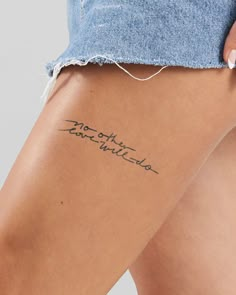 the back of a woman's thigh with writing on it and her name written in cursive ink