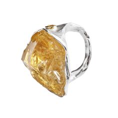 This enchanting ring by German Kabirski features a rough Citrine crystal believed to hold magical powers, serving as an amulet to protect against an ordinary mindset. Accented with yellow Sapphires, the crystal is set on a band plated with both White Rhodium and 18K Gold. Designed for those who embrace creativity and seek a unique expression, this piece is a fresh, artistic addition to any collection. Metal: 925 SilverStones: Rough Citrine, SapphirePlating: White Rhodium, 18K Gold  Please Note: Citrine Ring With Large Stone, Unique Citrine Gemstone Crystal Ring, Magical Powers, August Birthstone Jewelry, July Birthstone Jewelry, Fine Art Jewelry, Citrine Crystal, Jewelry Ring Box, Pearl Jewellery Earrings