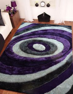 a purple and black rug in a living room