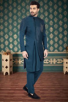 This sherwani, with its intricate cutdana embroidery, adds a touch of uniqueness to any sangeet or reception night. Stand out in style and elevate your look with this R14-S53 mens sherwani. Designer Nehru Jacket For Eid Reception, Designer Straight Kurta For Reception, Designer Kurta For Reception And Transitional Seasons, Designer Cutdana Kurta For Reception, Designer Kurta For Eid Reception, Designer Party Kurta With Traditional Drape, Designer Traditional Drape Sherwani For Party, Designer Traditional Sherwani For Party, Fitted Nehru Jacket With Dabka For Reception