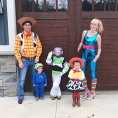 a family dressed up as toy story characters standing in front of a garage door for halloween