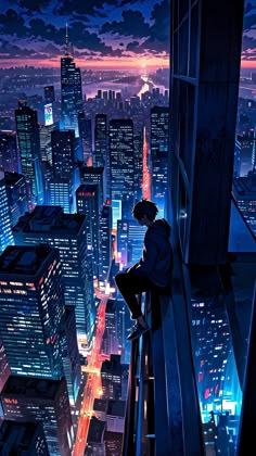 a man sitting on top of a tall building next to a city at night time