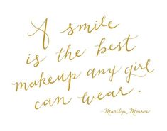 a smile is the best makeup any girl can wear quote on white background with gold lettering