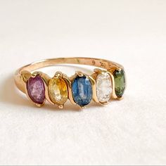 Multi Color Gemstone Vintage Ring 14K Yellow Gold Tourmaline Aquamarine Citrine Blue Sapphire All the gemstone are 4.8x3mm 2.8gm Size 10.25 sizing available with fee contact us to have it added to the price before checkout. Thank you for visiting our shop! 𝑫𝑴𝑲 𝑱𝒆𝒘𝒆𝒍𝒓𝒚 Each order will be beautifully packaged Our jewelry is 100% Authentic Please feel free to look at the other items I hope you will find something else that will like and interest you. EVERY DAY JEWELRY!!! Perfect gift for White Gold Opal Ring, Funky Rings, Vintage Gold Rings, Multi Gemstone Ring, Kay Jewelry, Rainbow Rings, Opal Ring Gold, Vintage Diamond Rings, Gem Ring