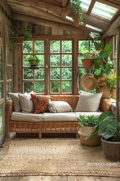 the sun room is filled with plants and wicker furniture, including an outdoor couch