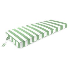 a green and white striped bench cushion