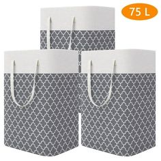 three gray and white shopping bags with handles