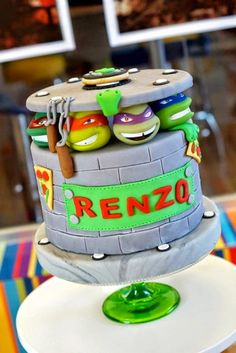 a cake made to look like the teenage mutant ninja turtles on top of a tower