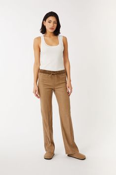 Unwind in pure comfort and effortless style with our stretch linen Tencel™ lyocell lounge pants. The relaxed fit through the hip and thigh guarantees maximum comfort, while exuding sophistication and relaxation. Linen is made from flax. Linen is woven from yarns spun from cellulose flax fibers from the stem of the flax plant. It uses less water, less pesticides, less land and easily grows. Tencel™ lyocell - sustainably sourced wood based fibers produced from a closed loop process that minimizes Comfortable Linen Straight Leg Pants, Comfortable Straight Leg Linen Pants, Neutral Linen Pants For Loungewear, Stretch Linen Pants With Elastic Waistband, Flax Straight Leg Lounge Pants, Flax Straight Leg Loungewear Pants, Flax Straight Leg Pants For Loungewear, Versatile Beige Linen Pants, Stretch Linen Wide-leg Pants