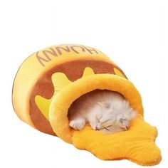 a cat is sleeping in a hot dog bed that's shaped like a chicken