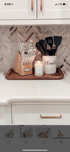 the kitchen counter is clean and ready to be used as a place for utensils