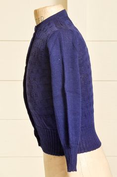 "1950s Deadstock Cardigan Sweater Navy Blue Basketweave Wool Knit Button Down Sweater Darling cardigan, deadstock with tags. Navy blue wool with buttons down the front. shoulders: 13'' chest: 28\" length: 17\" sleeve: 17\"" Blue Wool Cardigan With Buttons, Blue Wool Sweater With Buttons, Fitted Blue Wool Cardigan, Vintage Blue Knitted Cardigan, Blue Winter Sweater With Button Cuffs, Fitted Retro Blue Cardigan, Vintage Blue Button-up Cardigan, Blue Vintage Button-up Cardigan, Retro Blue Cardigan With Buttons