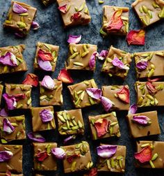 there are many pieces of chocolate with flowers on it, and one piece has been cut into squares