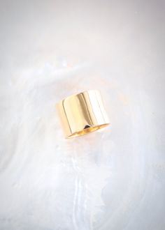 A statement gold wide band ring made from gold plated sterling silver. This gorgeous gold ring packs a punch. A modern staple for your collection.✦ DETAILS ✦✧ Name: Kahekili - (KAH heh KEE lee) - the thunder.✧ You will receive 1 ring 14mm wide. 9mm Band Sold Separately.✧ Available in whole sizes 5-11. PLEASE ORDER ONE SIZE UP; Wide rings fit tighter.✧ Gold Vermeil - gold plated sterling silver.✧ All Ke Aloha Jewelry pieces come packaged thoughtfully, beautifully, and ready for gift giving. Photo Gold Cuff Ring, Thick Gold Ring, Flat Ring, Hawaii Jewelry, Wide Band Ring, Gold Statement Ring, Knot Ring, Wide Rings, Gold Band Ring