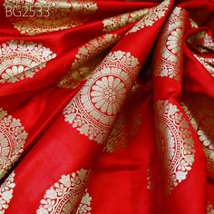 Red Brocade Fabric by the Yard Indian Wedding Dresses Varanasi Silk Crafting Sewing Costume Lehenga Valances Drapery Blouses Upholstery. This is a beautiful pure banarasi brocade in mandala design fabric in Red and Gold ➤Product: Brocade Fabric ➤Fabric Type: Blended (Viscose + Rayon) Fine Quality Zari Brocade Weaving from Banaras ➤Color: Base color is Red and Gold. ➤Width: 42 Inches ➤Condition: New  ➤Code: bg2533 ➤Listing for 1 Yard of fabric. ➤Care: Dry Clean Only Super Fine Quality Brocade Weaving from Banaras. During the Mughal period (1556-1707), when brocade was extremely popular with the rich, the great center of brocade weaving were Benares (Vārānasi). You can use this fabric to make Dresses, Tops, Blouses, Jackets, Crafting, Clutches or Evening Bags, Embellish your clothes, Pillows Red Traditional Wear For Marriage, Red Festive Lehenga For Marriage, Red Traditional Marriage Wear, Red Brocade Sets With Traditional Drape, Red Brocade Saree For Wedding, Festive Red Brocade Fabric, Red Traditional Wear With Pallu For Marriage, Red Wedding Fabric With Zari Work, Bollywood Style Fabric With Traditional Patterns For Wedding