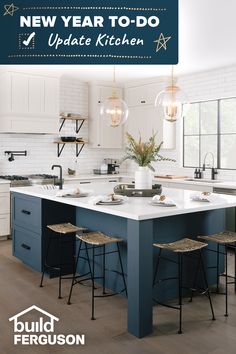 a kitchen island with two stools next to it and lights hanging from the ceiling