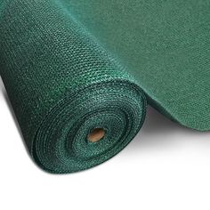 a roll of green fabric on a white background