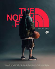 a man holding a basketball standing in front of the north face logo on a dark background