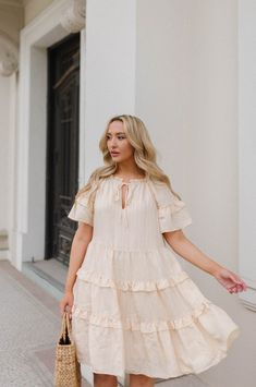 Feminine vibes and really easy to style. The Lucia Ruffle Dress is made from a natural cream high quality fabric. The pretty dress features dainty ruffles, tie detailing at the neck, fluttery short sleeves and a textural stripe pattern. Style the mini dress with heels, sandals or sneakers. Add a belt to cinch in the waist. Natural cream hue Lined Relaxed fit (Runs Large) Short sleeves Split neckline with tie detail Knee Length Belt not included* Worn to show a different way to style 64% Ray Air Clothes, Sunday Dresses, Feminine Vibes, Ruffle Trim Dress, Spring Boho, Natural Cream, Ruffle Mini Dress, Pretty Dress, Flutter Sleeve Dress