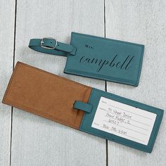 Personalize this luggage tag with any title and last name. Tag buckles onto luggage for easy identificationIncludes 1 luggage tag with a clear window to write name, address and phone numberAdjustable buckleBi-cast split leatherMeasures 4.5" L X 2.5" W X .75" HWeighs .2 lb.Imported Our stylish Wedded Bliss Personalized Luggage Tags are the perfect way to identify your bags or luggage when traveling. Luggage Tags Wedding, Leather Bag Tag, Teal Bag, Handmade Leather Tote Bag, Charcoal Bags, Personalization Mall, Leather Anniversary Gift, Leather Anniversary, Stylish Name