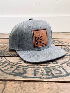 "Big Bro Snapback Hat for baby/toddler, youth or adult. These Big Brother caps are great for a pregnancy announcement or reveal, new baby gift for the big brother or to keep your son looking styling while showing off his big brother status! High quality, stylish and durable to hold up to the hat loving boys in your life! These caps are sure to be a loved and treasured gift! Sizing: On average our hats will fit the age ranges specified below with the ability to adjust the Snapback as your child g Adjustable Flat Bill Baseball Cap, Pregnancy Announcement Big Brother, Brother Status, Pregnant With Boy, Mens Cap, Big Brother Gift, Fawn Design, Pregnancy Reveals, Gifts For Brother