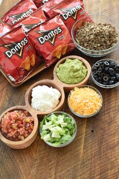 the ingredients to make an easy mexican salad laid out on a wooden table