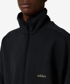 Founded in the 1940s, adidas has become a global leader in sportswear, known for its innovative designs and commitment to performance.This adidas Track Jacket x Fear of God Athletics in black is a standout piece from the Fall/Winter 2024 collection. The collaboration with Fear of God brings a unique edge to this sporty jacket, perfect for adding a touch of style to your athletic wardrobe. Don't miss out on this exclusive piece, available now at SVD. Sporty Jacket, Adidas Track Jacket, Brand Collaboration, Adidas Track, Fall Winter 2024, Fear Of God, Unique Aesthetic, Winter 2024, 2024 Collection