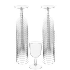 three clear vases and a wine glass on a white background