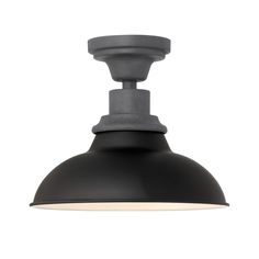 an industrial style light fixture with a black shade on the top and white trims