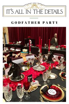 a table set for a party with red and black decorations, candles, and plates