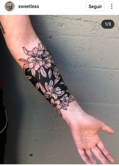 a person's arm with flowers on it