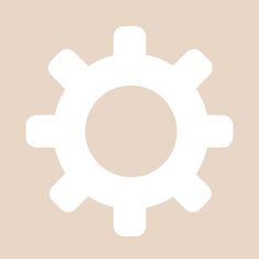 an image of a white cogwheel icon on a beige and tan background with space for text