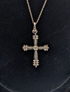 "Vintage Avon Sterling Silver 925 Cubic Zirconia Cross Pendant Chain Necklace  B2 Chain measures 19\" end to end, cross pendant measures 1 x 5/8\".   The sterling silver has small amount of tarnish, but could easily be polished.   Marked 925 Avon on the back of the cross, chain is unmarked.  Please note that any vintage jewelry may have mild wear or imperfections because it is pre-owned and not brand new.   Any damage or issues will be noted above. Please see photos for details as they are part of the description.    All measurements are approximate. See my other listings, I have lots more jewelry.  I am happy to combine shipping on any of my items whenever possible. Canada & USA shipping only. Message me for a shipping quote, combined invoice or with any other questions. :)" Antique Silver Cross Pendant Necklace, Antique Sterling Silver Cross Pendant Necklace, Vintage Sterling Silver Cross Pendant Necklace, Avon Cross Necklace, Nickel-free Antique Silver Cross Pendant Necklace, Cross Chain, Vintage Avon, Vintage Cat, Abandoned Places